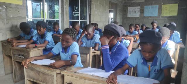 Pupils writing in class